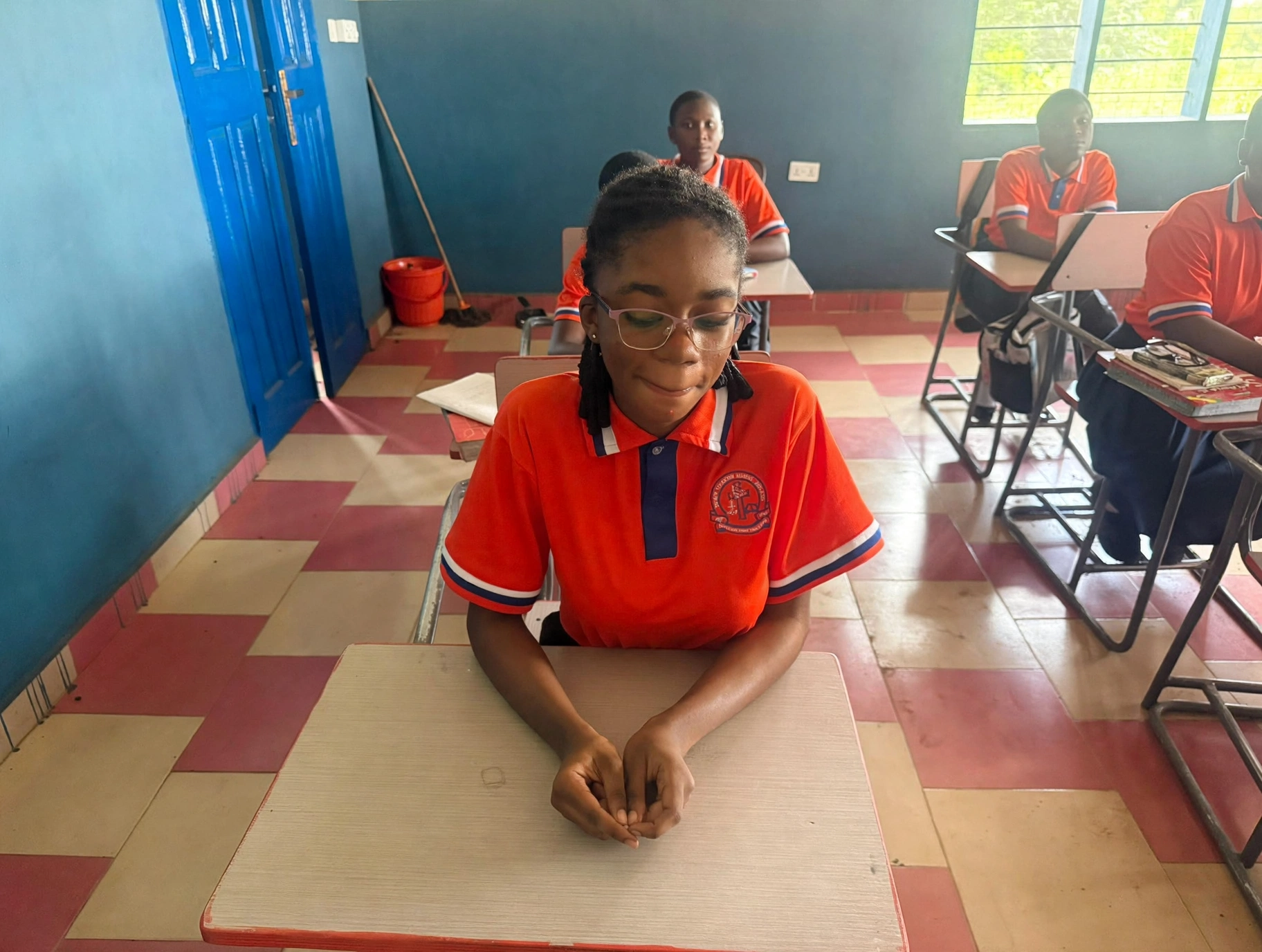 A pupil settling in for class
