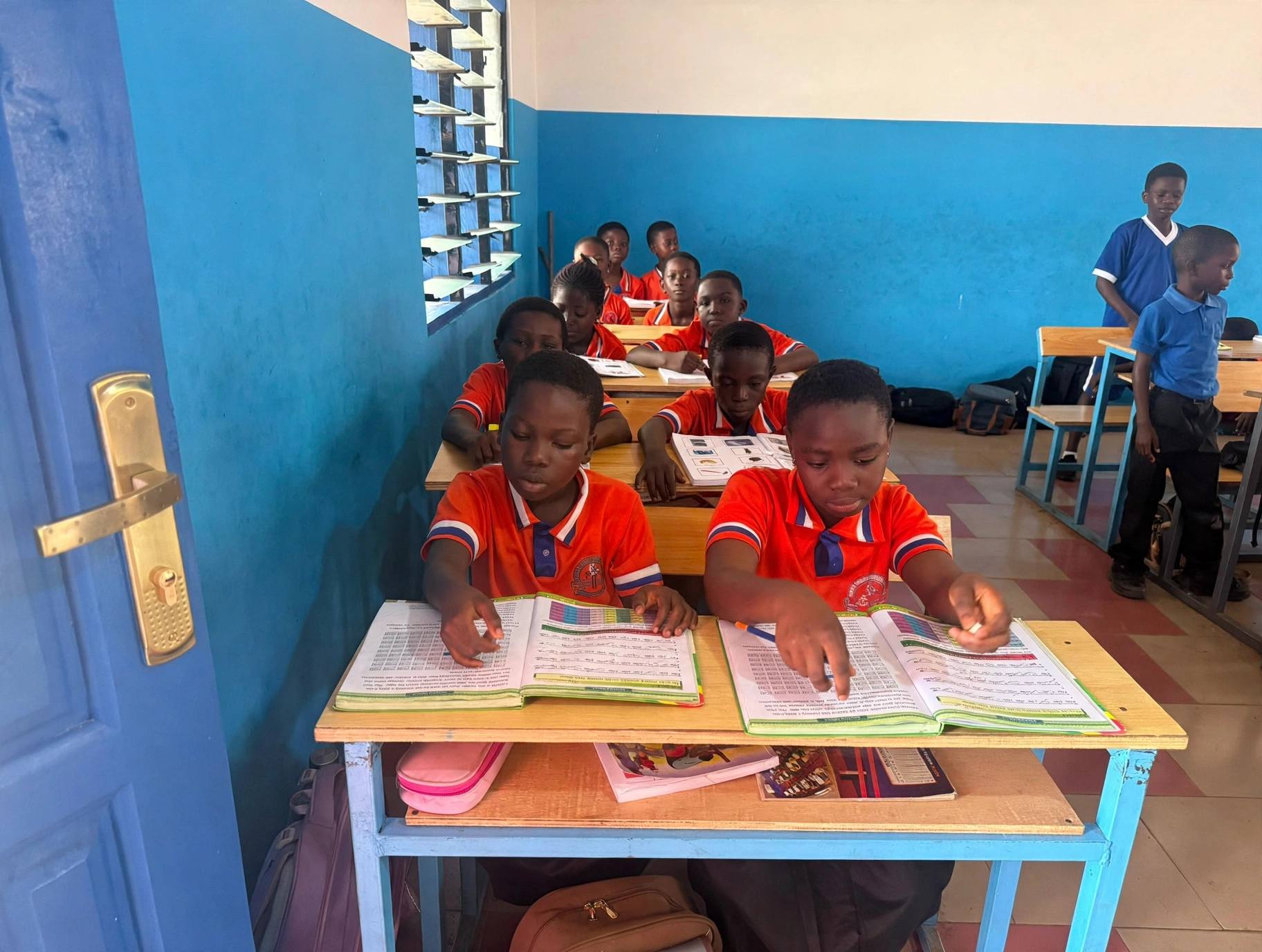 A pupil at her desk in class